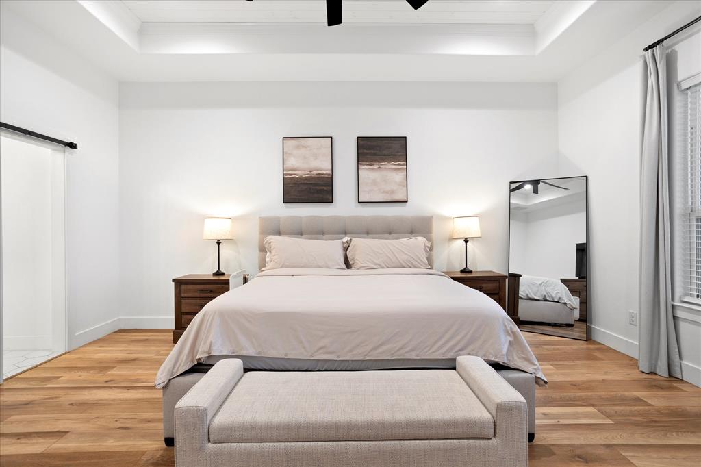 1074 Pioneer Crossing Weatherford, TX 76088 - Photo 18 of 36 a bedroom with a bed and a night stand