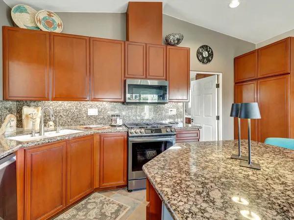 a kitchen with a stove and a sink