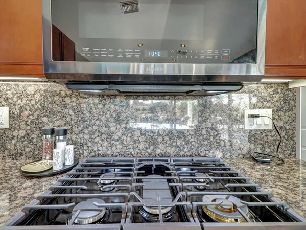 a view of a bedroom with wooden floor and closet