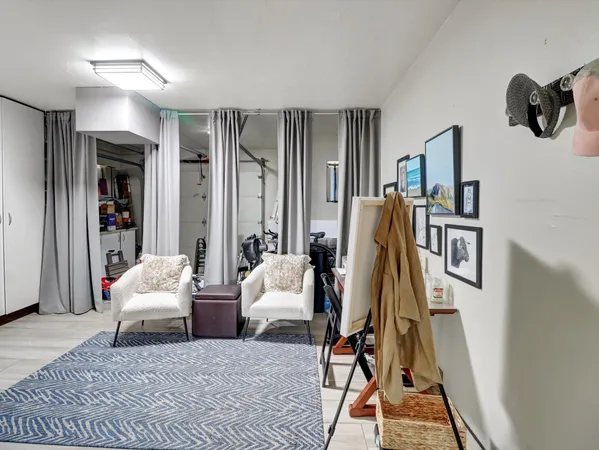 a view of a patio with table and chairs potted plants