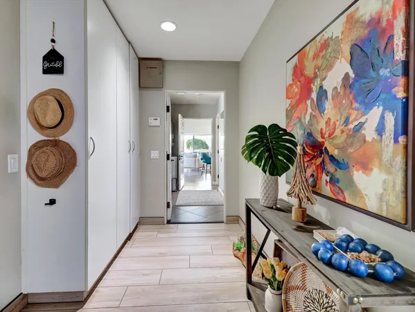 a view of a patio with table and chairs and potted plants