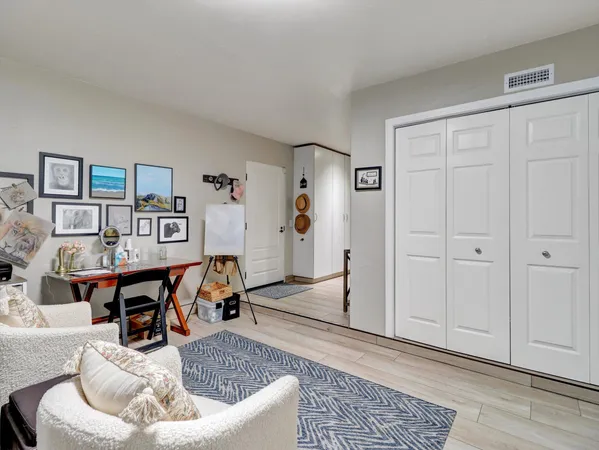 a bedroom with bed and a night stand