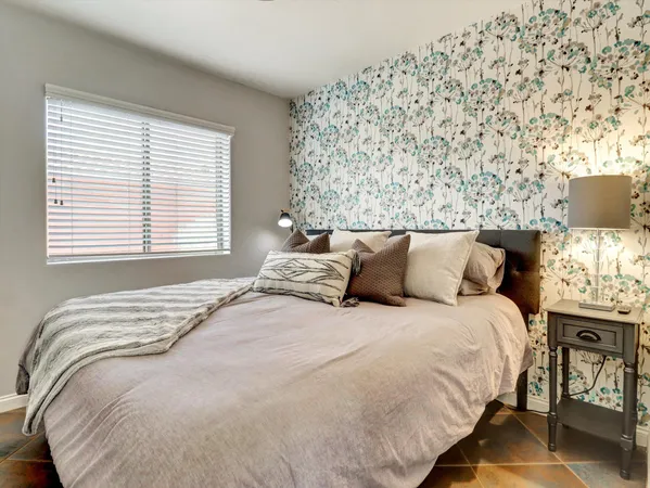 a bathroom with a double vanity sink toilet mirror and shower