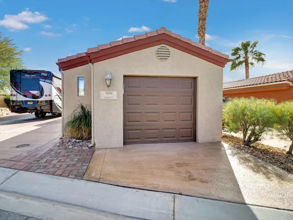 a kitchen with stainless steel appliances granite countertop a refrigerator stove and sink