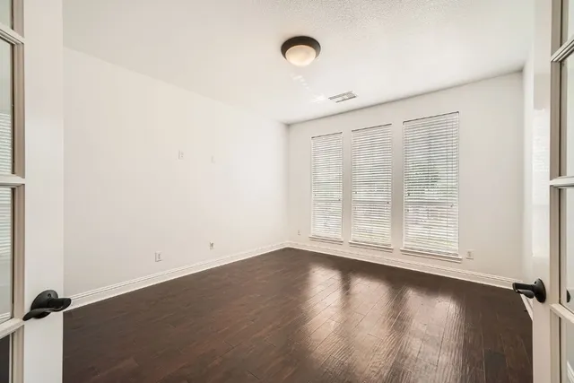 an empty room with windows