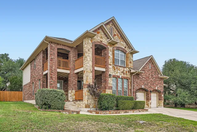 a front view of a house with a yard
