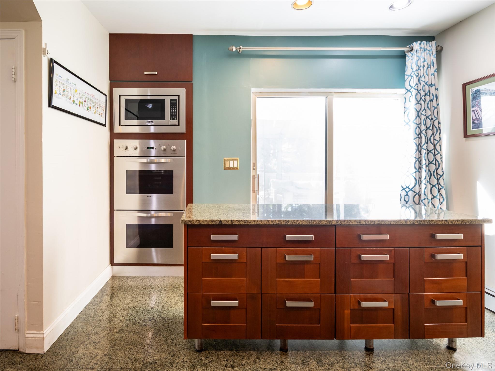100 Station Road Great Neck, NY 11023 - Photo 13 of 29 a kitchen with a cabinets and appliances