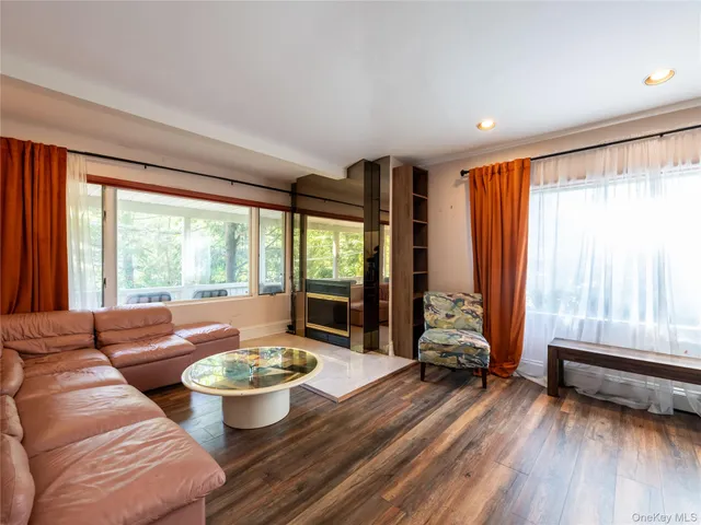 a spacious bedroom with a large bed and a large window