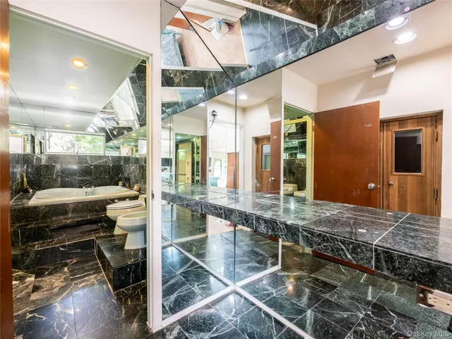 a bedroom with a bed and a desk