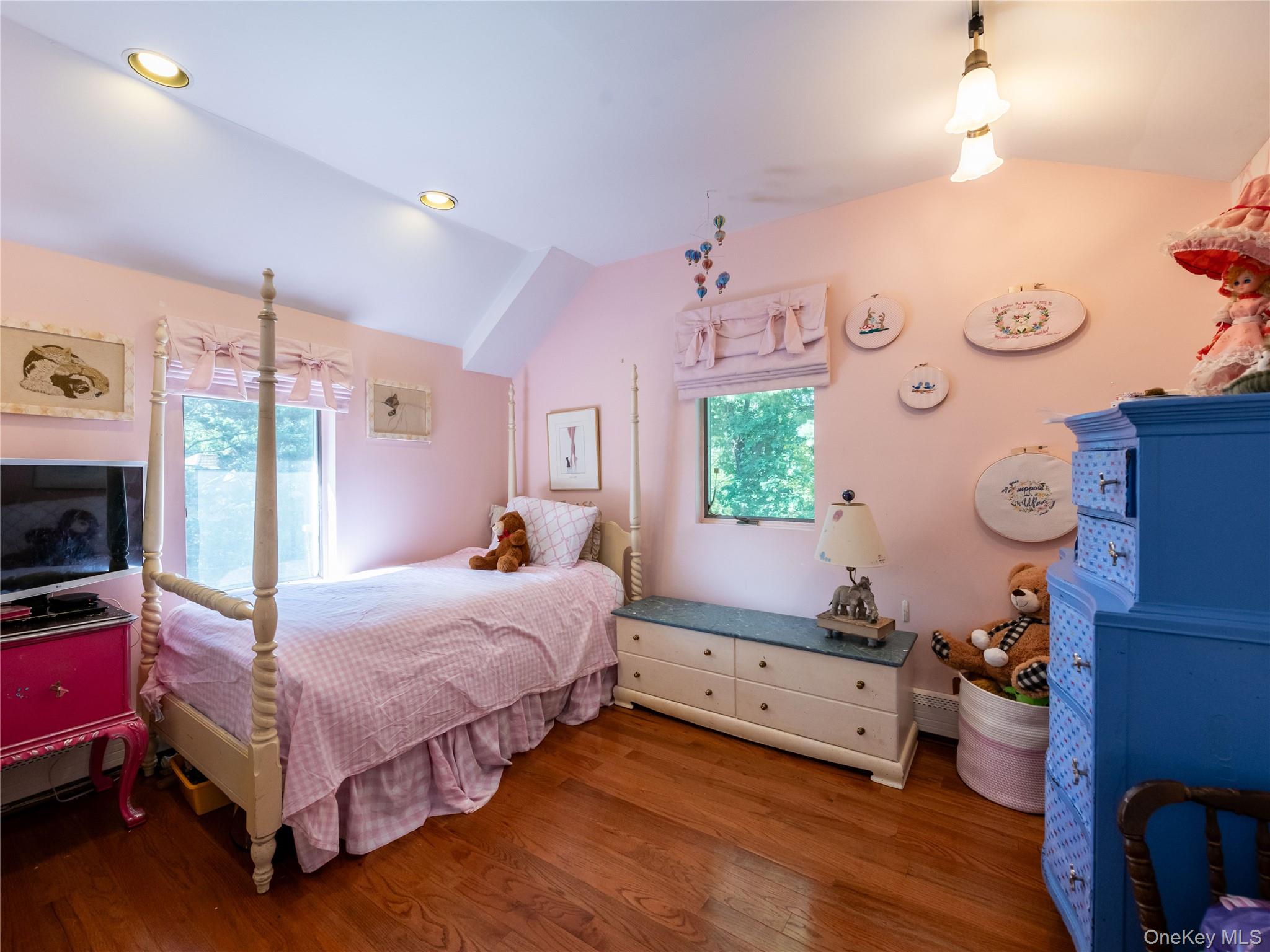 100 Station Road Great Neck, NY 11023 - Photo 21 of 29 a bedroom with a bed and a window