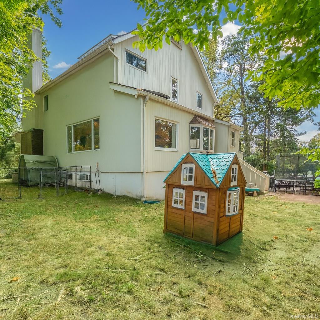 100 Station Road Great Neck, NY 11023 - Photo 23 of 29 a view of a house with a yard
