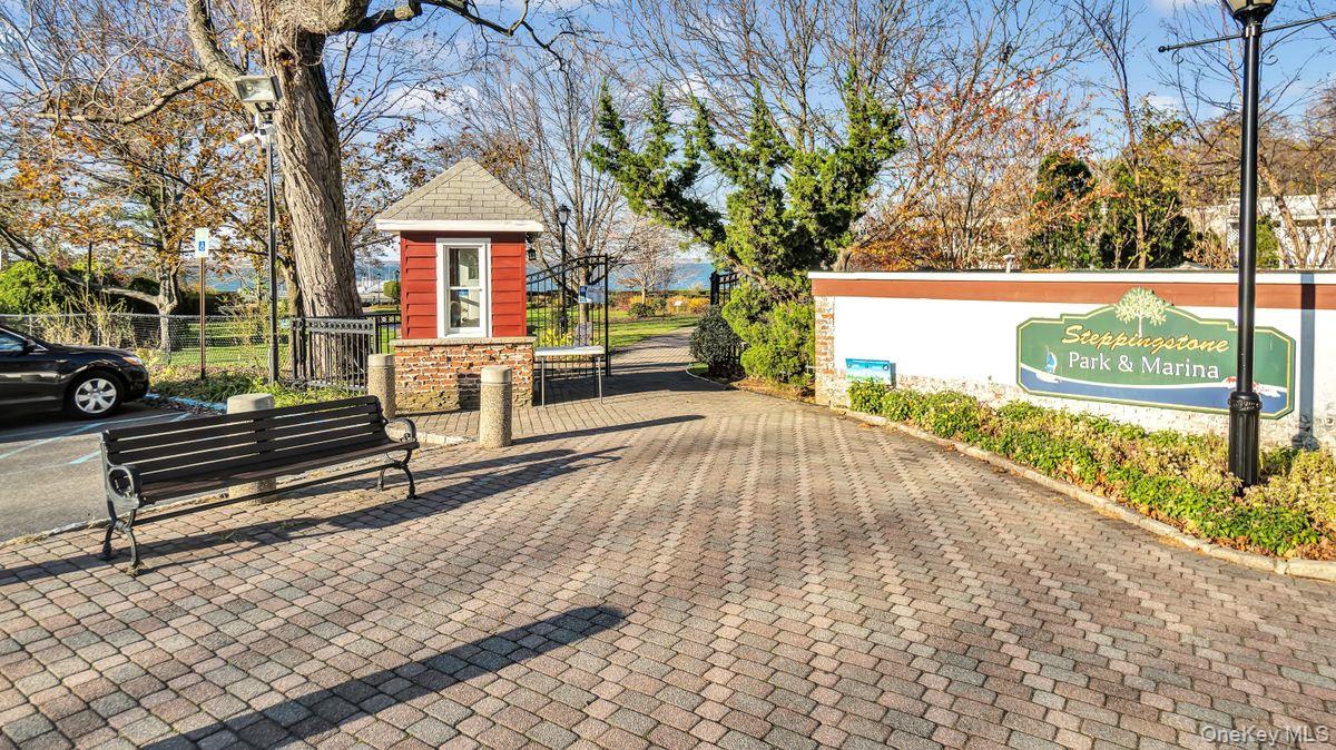 100 Station Road Great Neck, NY 11023 - Photo 27 of 29 a view of a house with backyard porch and sitting area