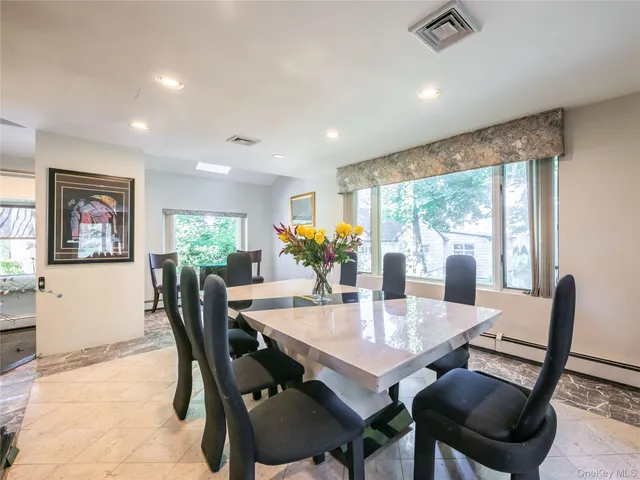 a view of a dining room with furniture window and outside view