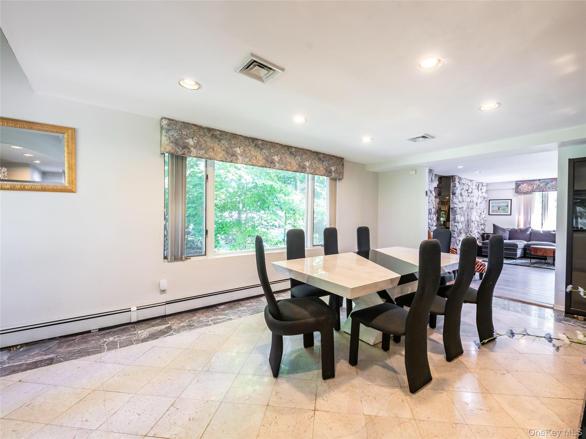 100 Station Road Great Neck, NY 11023 - Photo 8 of 29 a view of a dining room with furniture window and outside view