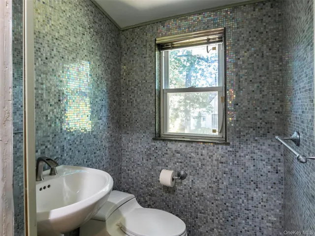 a large kitchen with stainless steel appliances granite countertop a sink and cabinets