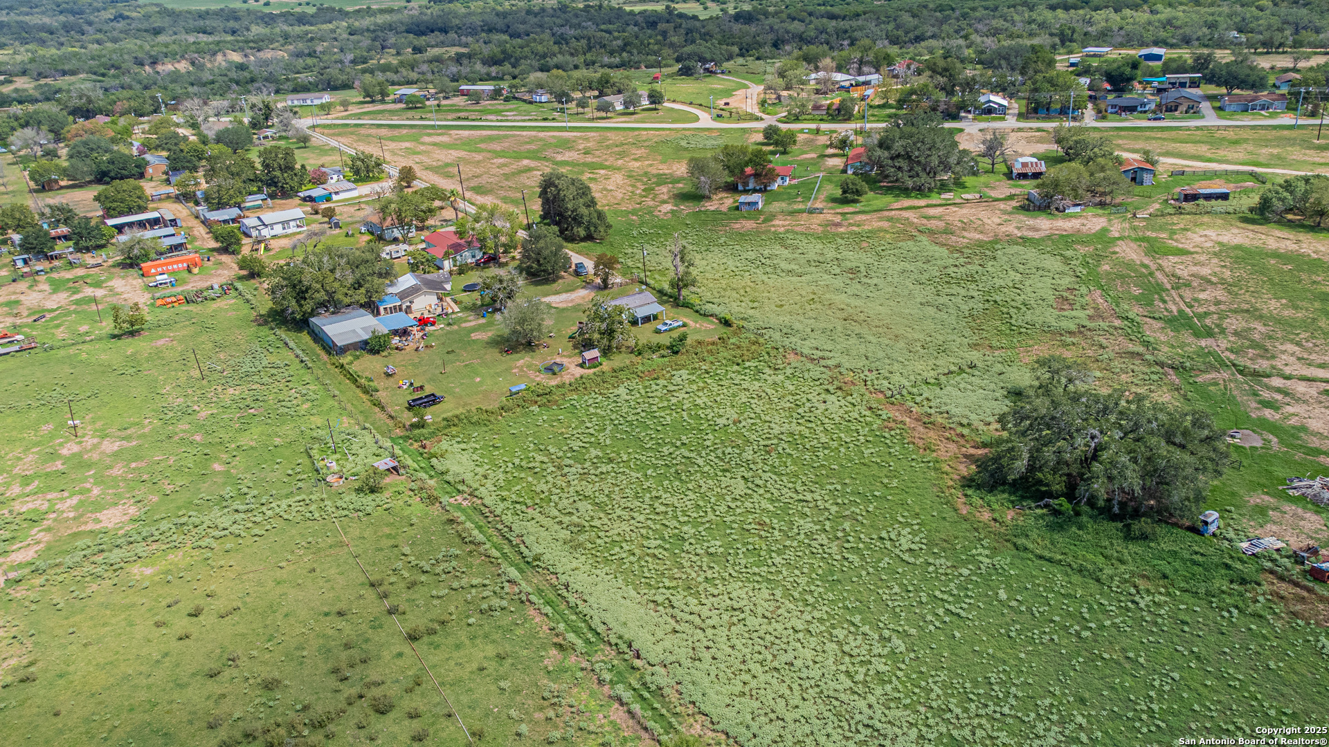 146 County Road 166 Elmendorf, TX 78112 - Photo 10 of 14 a view of a lake with a city
