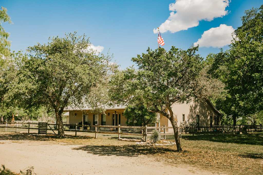 375 Co Road Uvalde, TX 78801 - Photo 11 of 30 a front view of a house with a yard