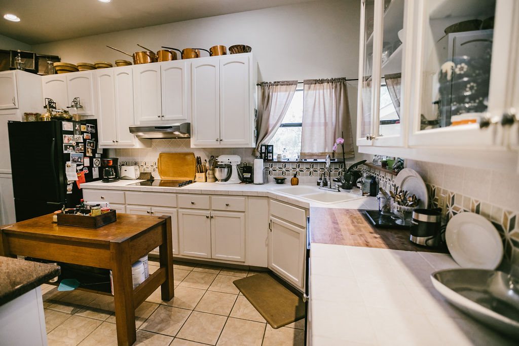 375 Co Road Uvalde, TX 78801 - Photo 22 of 30 a kitchen with a sink appliances and cabinets