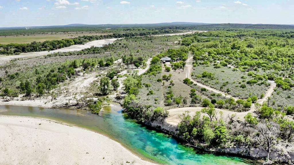 375 Co Road Uvalde, TX 78801 - Photo 28 of 30 an aerial view of residential houses with outdoor space and river