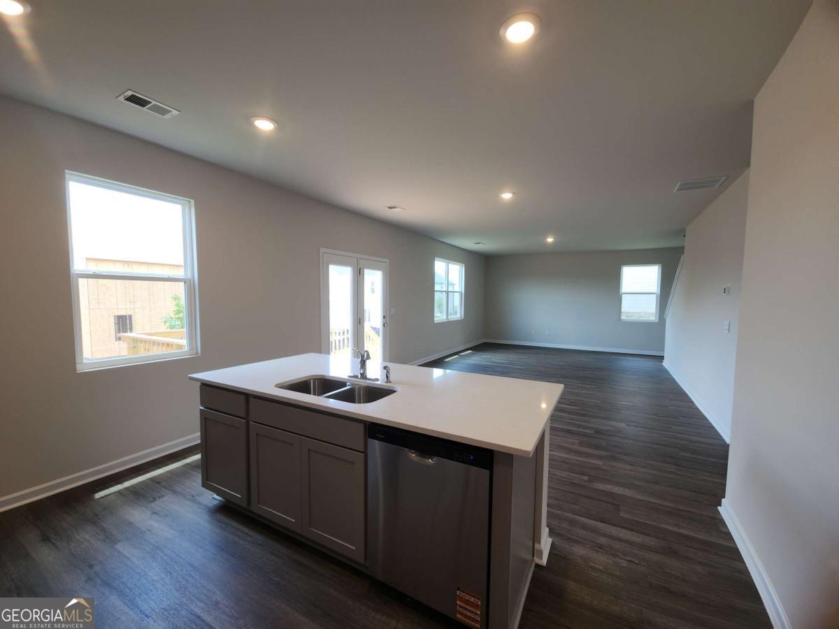 191 Aster Avenue Locust Grove, GA 30248 - Photo 20 of 28 a kitchen with sink and window
