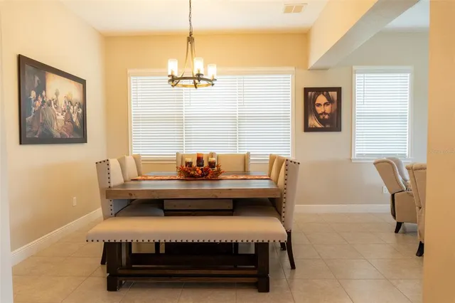 a living room with furniture a window and a flat screen tv