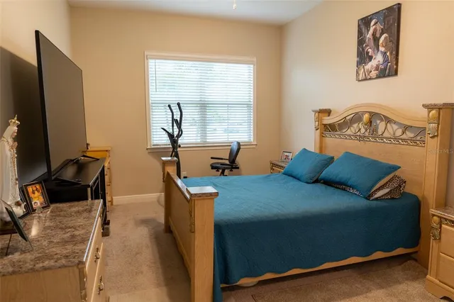 a bathroom with a granite countertop toilet sink and mirror