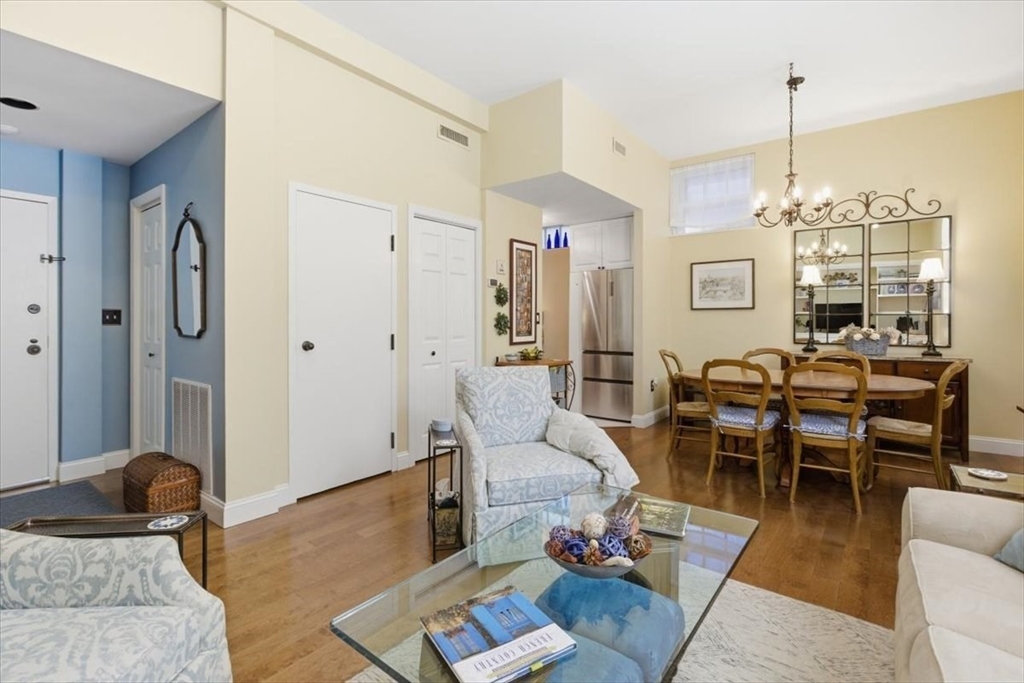 65 Glen Road, Unit H1 Brookline, MA 02445 - Photo 5 of 39 a living room with furniture and a chandelier