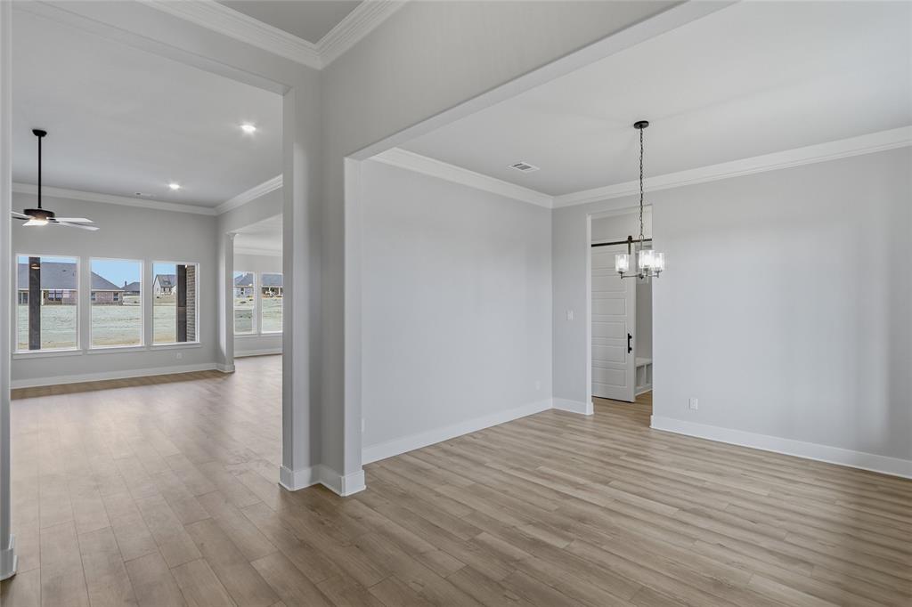 812 Vly Rdg Road Van Alstyne, TX 75495 - Photo 4 of 33 a view of a room with wooden floor