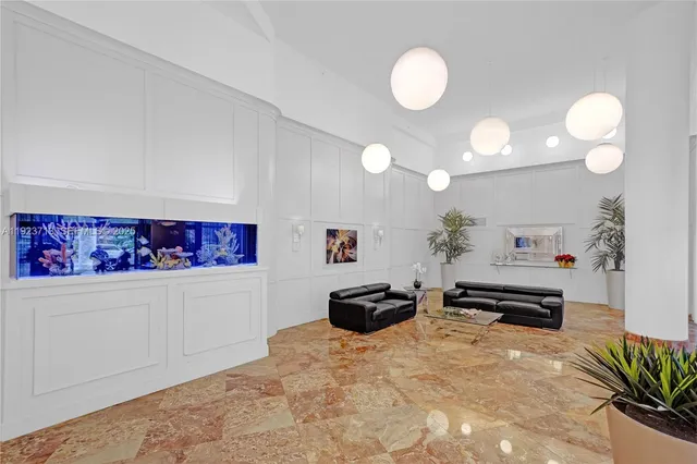 a bedroom with furniture and a large mirror