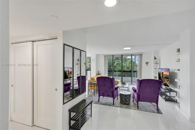 a view of a livingroom with furniture and a window