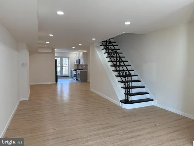 a view of entryway with wooden floor