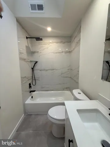 a bathroom with a toilet and a sink