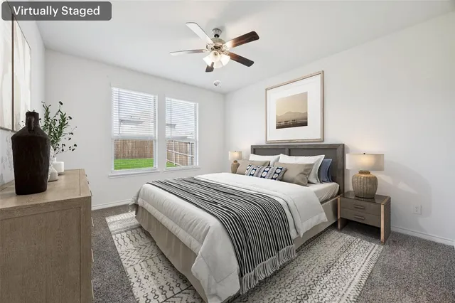 a bedroom with bed and a window