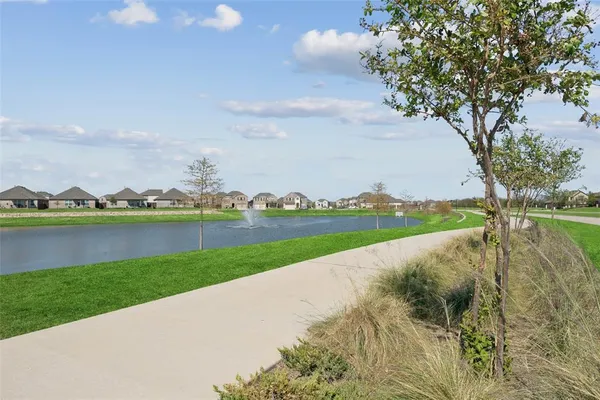 a view of a lake with a big yard