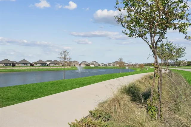 a view of a lake with a big yard