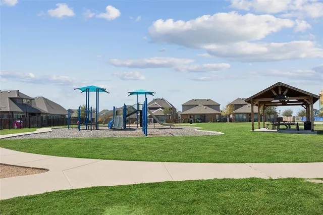 a view of a big yard in front of a house