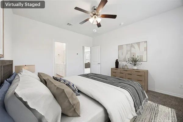 a bedroom with bed and a chandelier