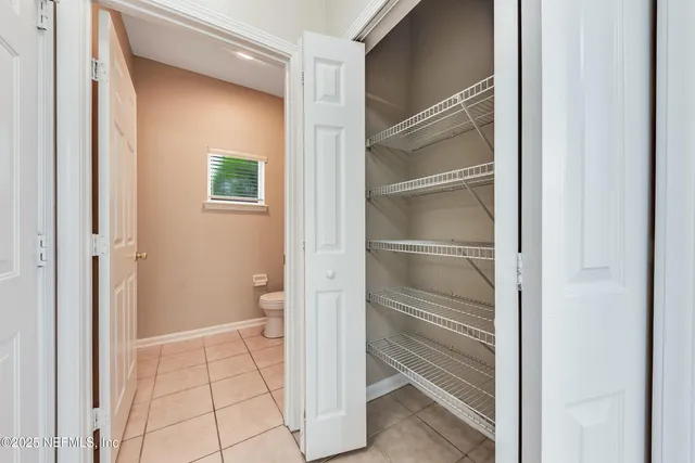 a view of bathroom and closet