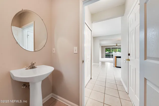 a bathroom with a sink and mirror