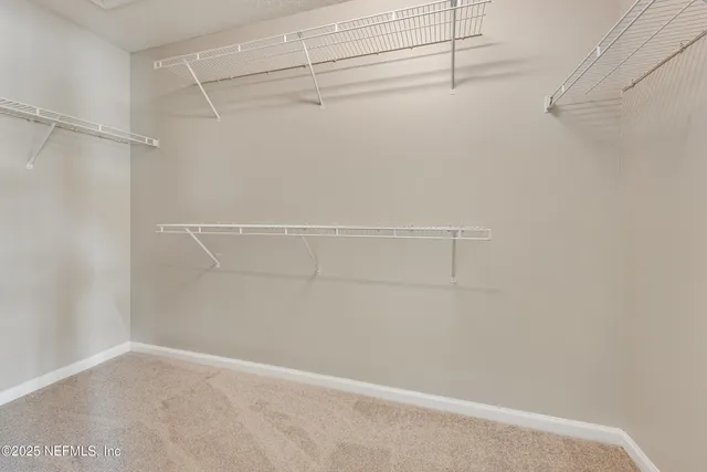 a view of an empty walk in closet