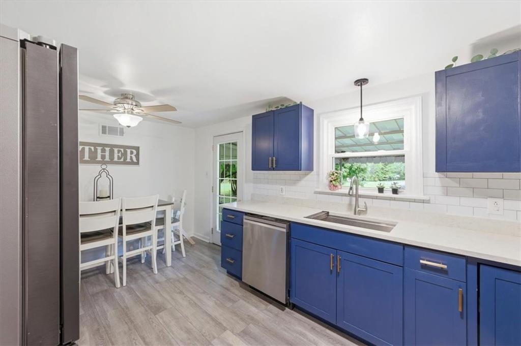 344 Winfield Road Cabot, PA 16023 - Photo 11 of 30 a kitchen with a sink and chairs