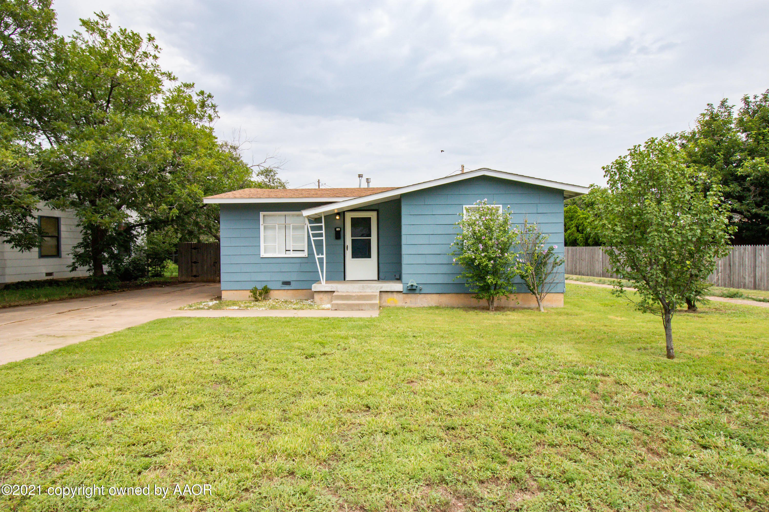 4629 South Lipscomb Street Amarillo, TX 79110 - Photo 1 of 12 a house view with swimming pool and garden space