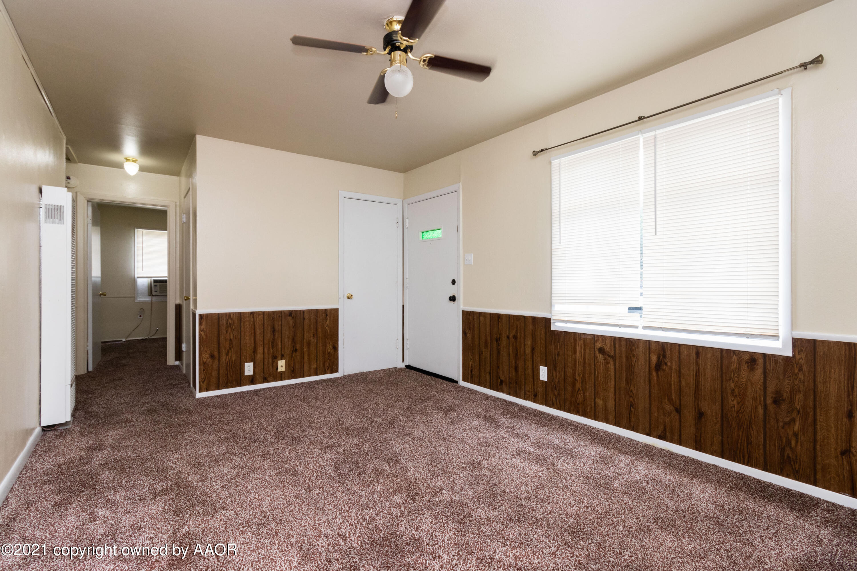 4629 South Lipscomb Street Amarillo, TX 79110 - Photo 4 of 12 wooden view of an empty room with a window