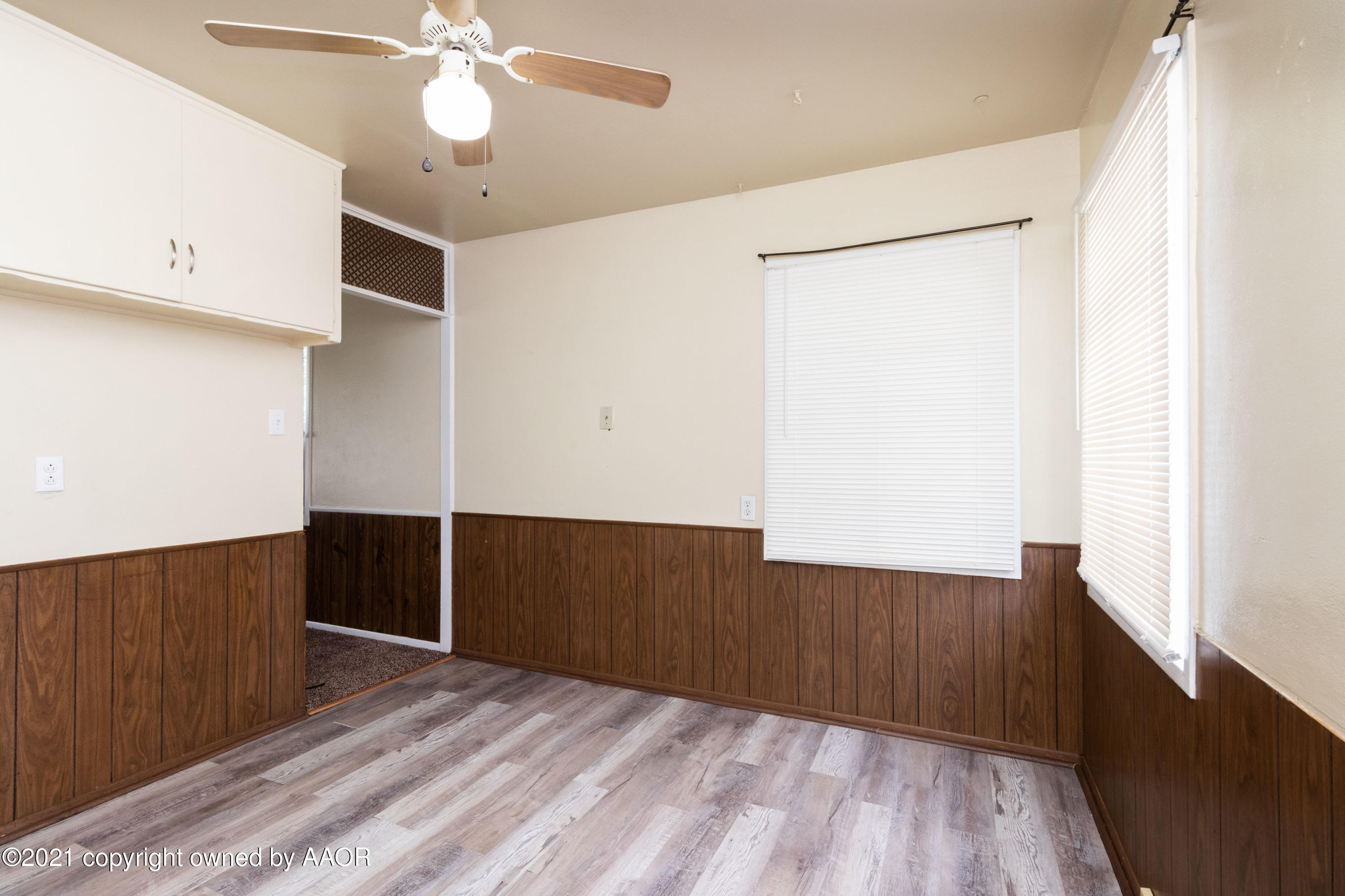 4629 South Lipscomb Street Amarillo, TX 79110 - Photo 6 of 12 a view of an empty room with wooden floor
