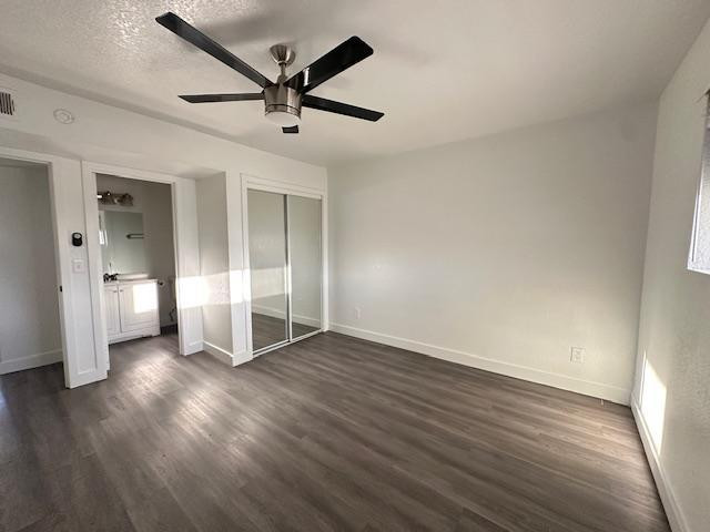18202 North Cave Creek Road, Unit 209 Phoenix, AZ 85032 - Photo 11 of 12 an empty room with wooden floor and ceiling fan