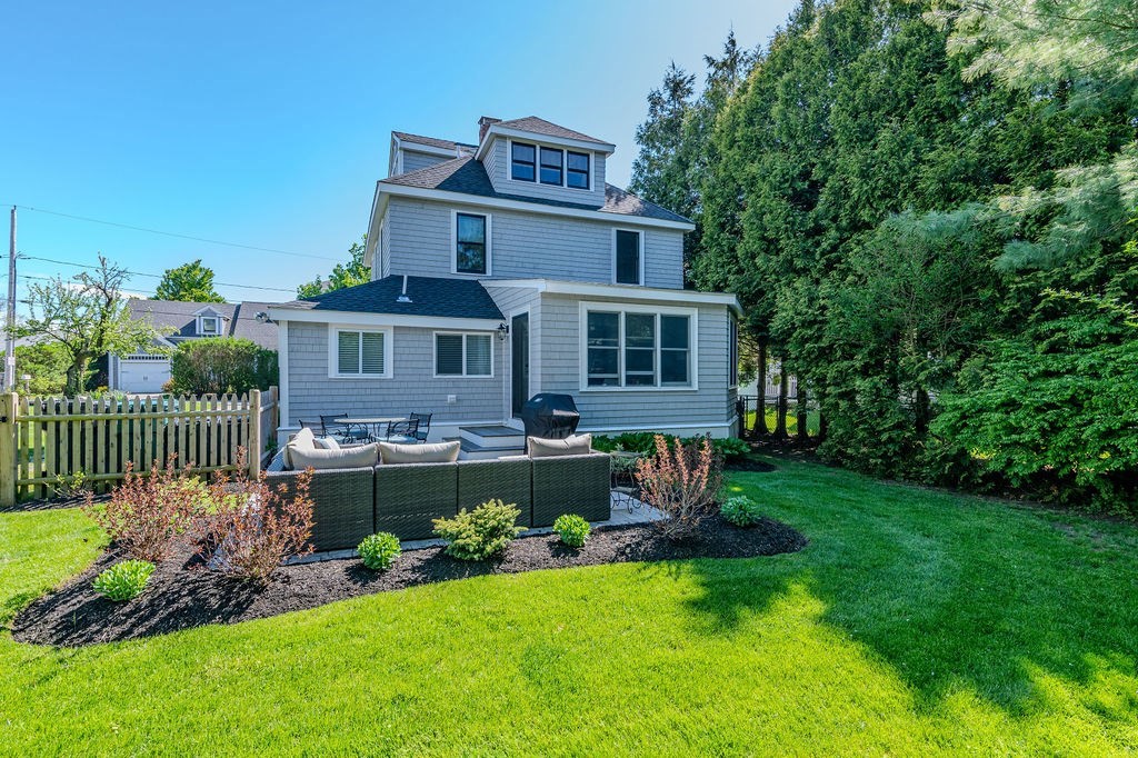 20 Driftway Scituate, MA 02066 - Photo 27 of 42 a front view of a house with a garden and plants