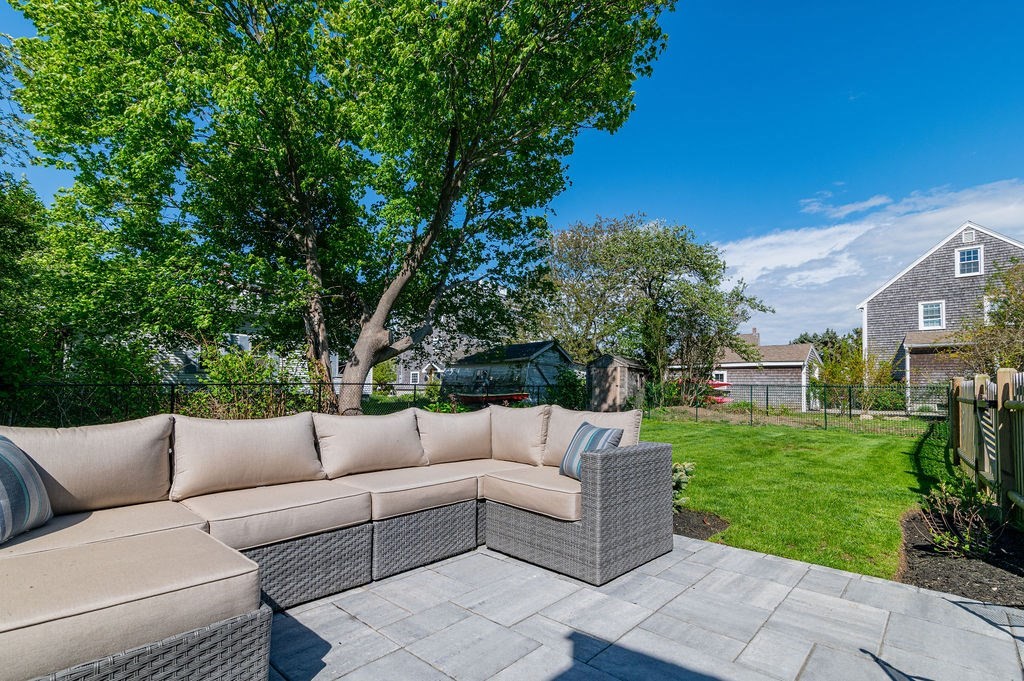 20 Driftway Scituate, MA 02066 - Photo 28 of 42 a view of a patio with couches and a big yard
