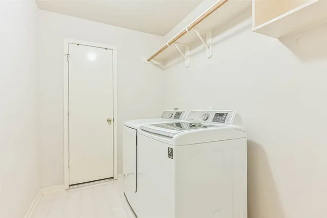 a utility room with dryer and washer
