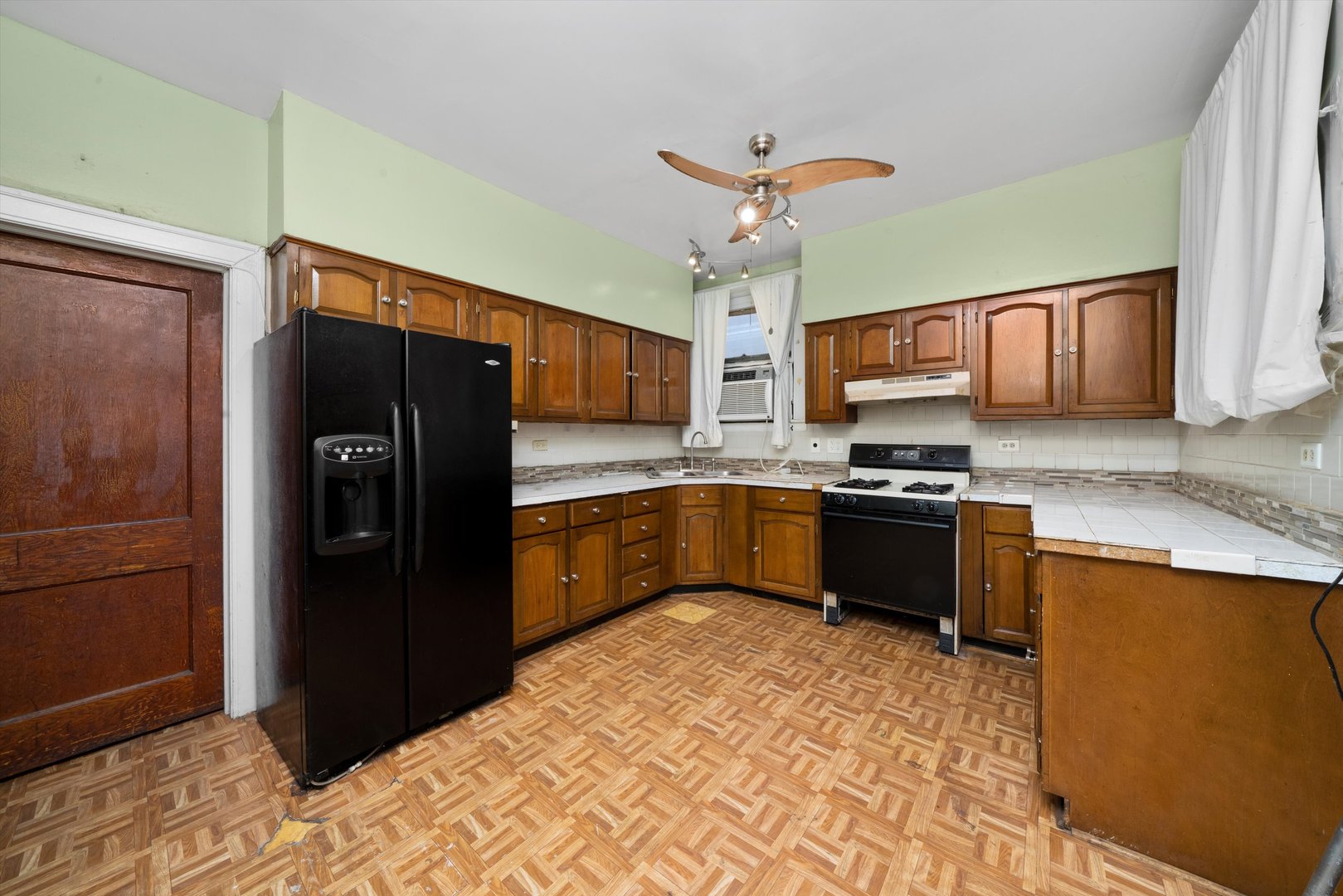 7611 South Aberdeen Street Chicago, IL 60620 - Photo 14 of 45 a kitchen with stainless steel appliances granite countertop a refrigerator stove and sink