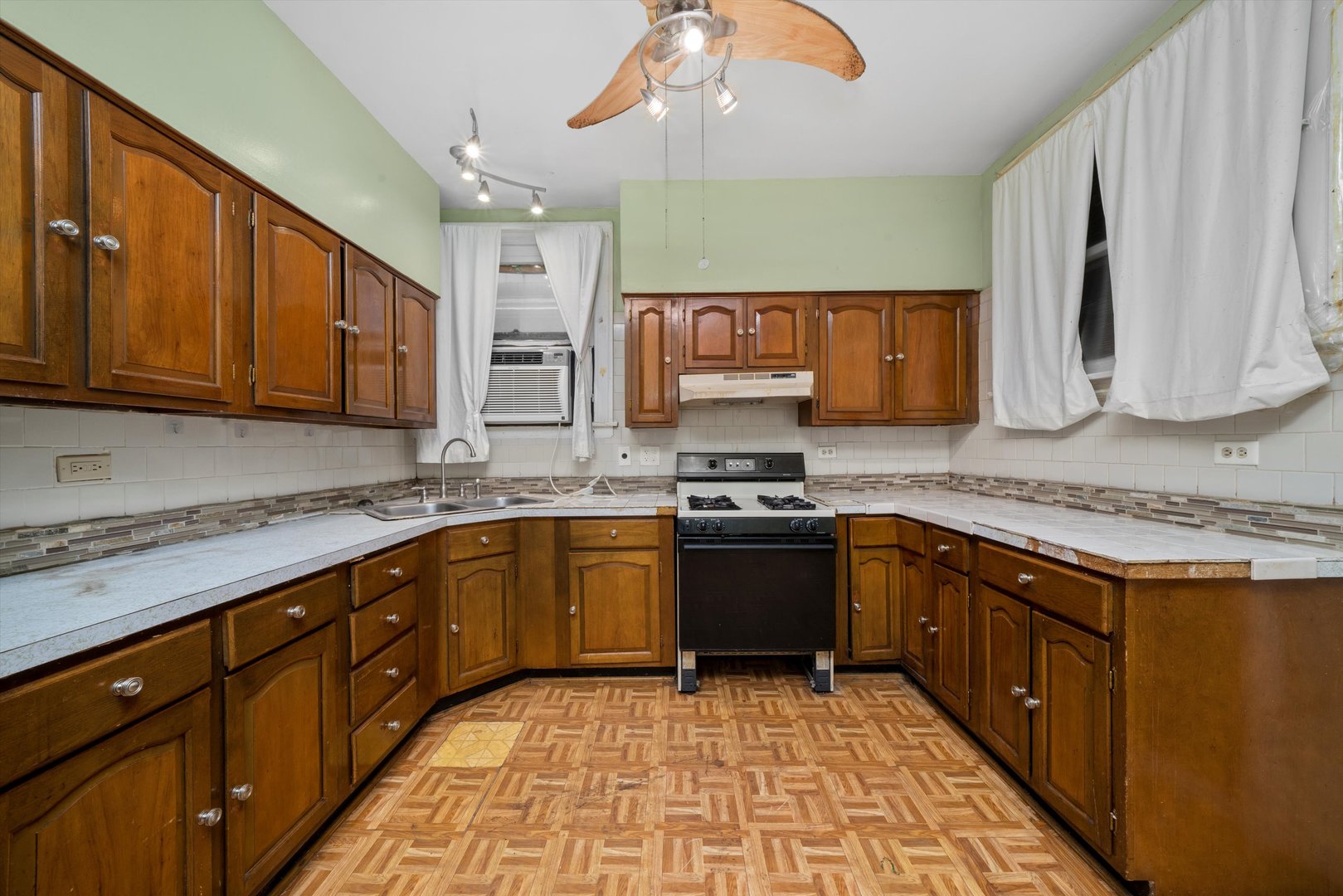 7611 South Aberdeen Street Chicago, IL 60620 - Photo 15 of 45 a kitchen with stainless steel appliances granite countertop a sink stove and cabinets